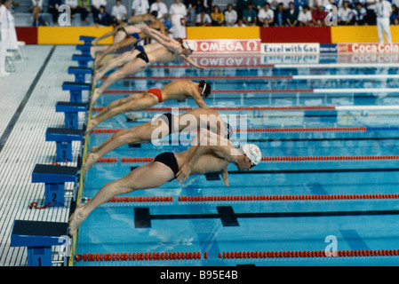 England Sport Water Swimming View across the start line at Crystal Palace as swimmers dive in Stock Photo