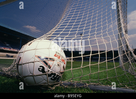 SPORT Soccer Close up of a football in the net at the back of the goal Stock Photo