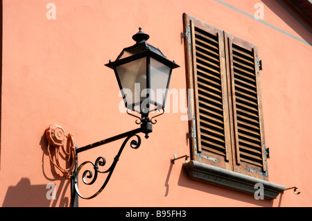 A shuttered window to prevent the heat of the day entering a house. Stock Photo