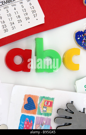 Coloured magnetic ABC Letters on a white refrigerator door Stock Photo