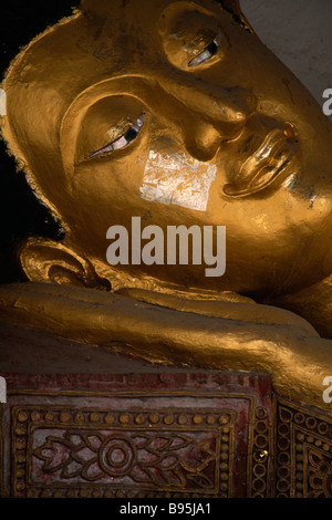 THAILAND North Chiang Mai Wat Chedi Luang Temple Face of reclining sleeping Buddha with gold leaf on the face Stock Photo
