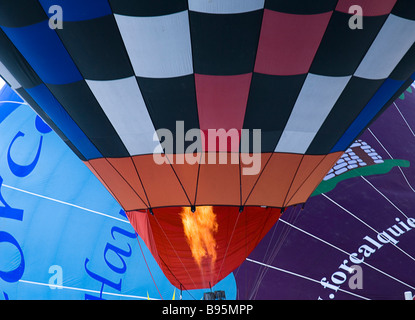 Switzerland, Canton de Vaud, Chateau d'Oex, Hot Air Balloon Festival.  Cropped view of balloons being inflated. Stock Photo