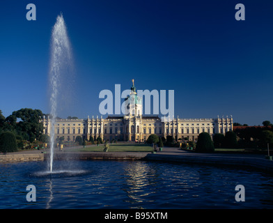 Germany, Berlin, Charlottenburg Palace. View to palace across fountain and pond in the rear gardens. Stock Photo