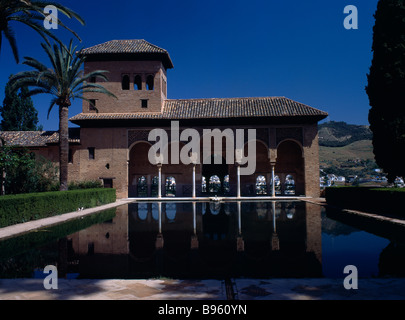 Spain, Andalucia, Granada, The Alhambra, Palacio del Partal, general view of the Ladies Tower and colonnade reflected in pond. Stock Photo
