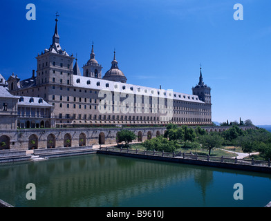 SPAIN Madrid State El Escorial Palace of San Lorenzo de El Escorial seen from the west side with large water pool in foreground Stock Photo