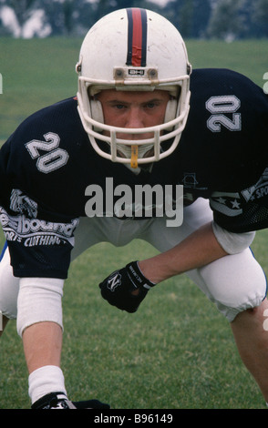 SPORT Ball Games American Football British American footballer wearing body protector and helmet in defensive stance. Stock Photo