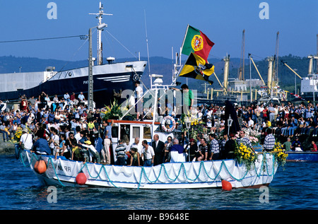 A fishing trawler taking part in the colourful Romaria de Nossa Senhora d'Agonia festivities in Viana do Castelo, Portugal Stock Photo