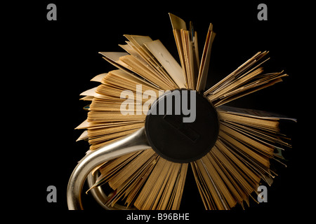 old crammed Rolodex rotary file holder, dark background Stock Photo