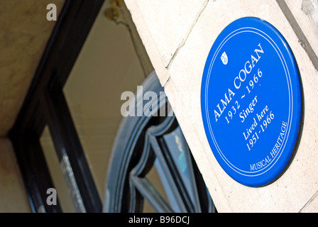 blue plaque marking a former home of singer alma cogan, in kensington high street, west london, england Stock Photo
