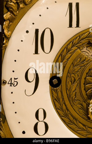 Close up of hand on clock face Stock Photo