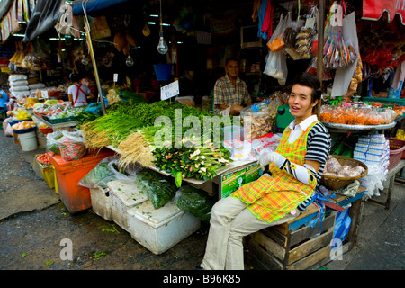 Man poses for photograph at Talad Klong Toey Bangkok Thailand local Thai market Stock Photo