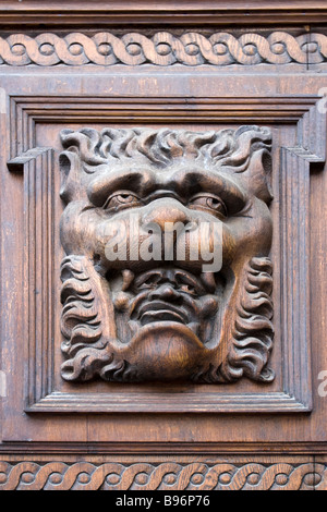 Old Town City Hall (Staromestske Namesti) door wood carvings of lion head with man head in his mouth, Prague,Czech Republic. Stock Photo