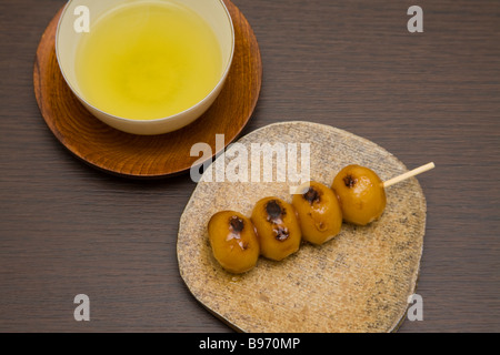 Skewered dumpling with Japanese green tea Stock Photo