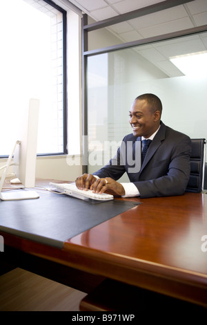 Businessman typing on computer keyboard Stock Photo