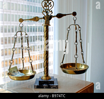 Scales of justice influenced by capital or monetary means Stock Photo