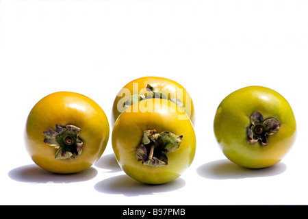 Four persimmons Stock Photo
