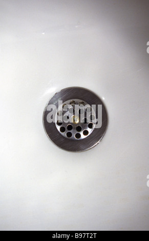 a drain in sink, a drain in bath tub. Stock Photo