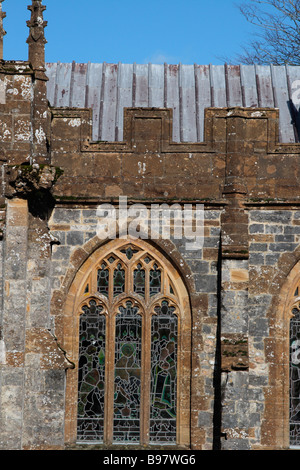 St Mary's Church Chard Somerset UK. ARchitectural detail of gothic church window with tracery, crenellated parapet and lead roof Stock Photo
