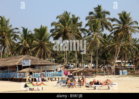 India Goa Colva beach tourists palms seaside restaurant Stock Photo