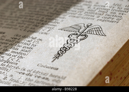 Caduceus symbol on a dictionary page Stock Photo
