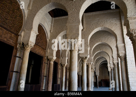 In Tunisia's holy city of Kairouan an exquisite colonnade of arches marks the entry to the historic Great Mosque Stock Photo