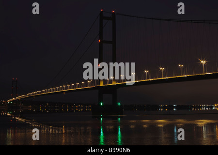 Humber Suspension Bridge low tide at night shot from south bank in Lincolnshire, River Humber, England, UK Stock Photo