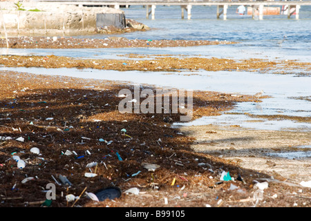 Trash and pollution is blown onto the beaches from the Gulf of Mexico. Stock Photo