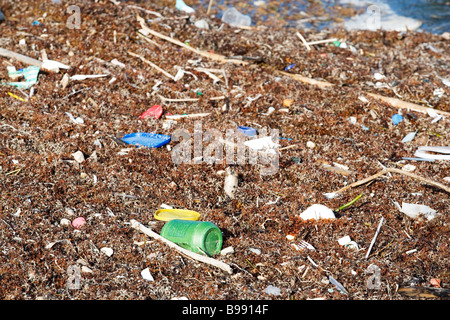 Trash and pollution is blown onto the beaches from the Gulf of Mexico. Stock Photo