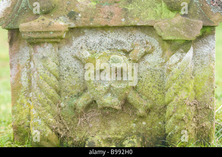 Plague marker on headstone in graveyard at Melrose Abey Stock Photo