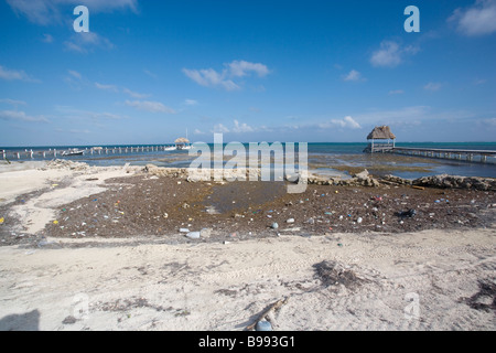 Pollution, trash, and debris washes up onto the shore from the open waters of the Gulf of Mexico. Stock Photo