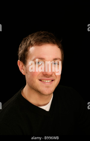 happy teenager young handsome man head and shoulders cool confident assured Stock Photo