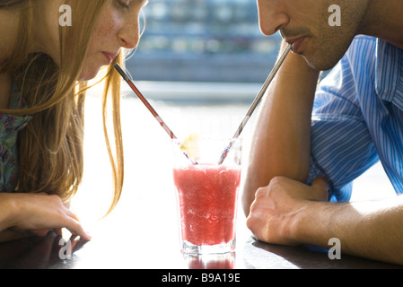 Couple sharing cool drink, cropped Stock Photo