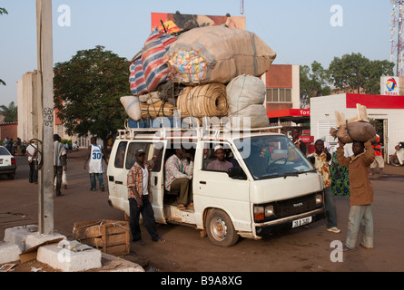 West Africa Burkina fasso Ougadougou overloaded minibus in the street Stock Photo