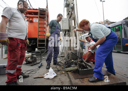 Workers repairing an electricity network in Budapest, Hungary Stock Photo