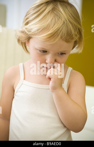 Little girl picking nose Stock Photo