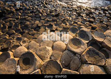 Giant's Honeycomb. The basalt columns of the causeway sweep down to the sea forming a  complex honeycomb-like pattern of rock Stock Photo