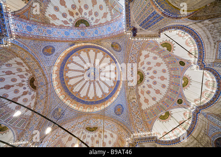 Complexity in Colour. The highly decorated ceramic covered ceiling of the Blue Mosque is full of light and color. Stock Photo