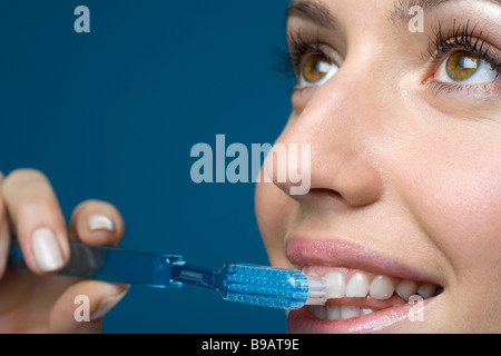 Close up of woman brushing teeth Stock Photo
