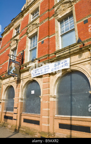 Boarded-up pub King William IV pub on main shopping street in Newport South Wales UK Stock Photo