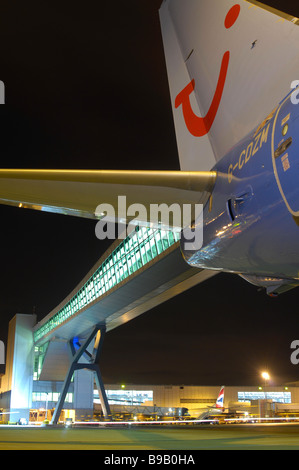 Aircraft and bridge at night Stock Photo