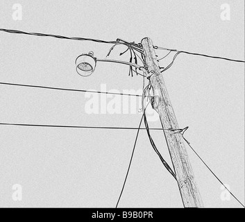 sillouette utility pole and wires and street lamp like drawing Stock Photo