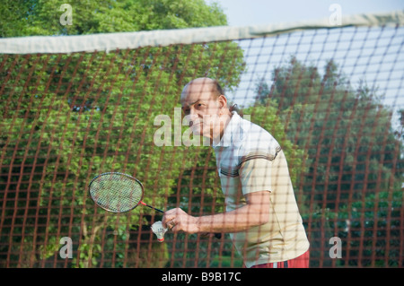 Man playing badminton in a park, New Delhi, India Stock Photo