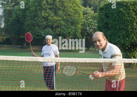 Couple playing badminton in a park, New Delhi, India Stock Photo