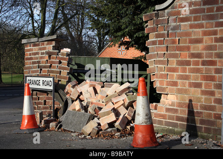 Accident damaged brick wall. Stock Photo