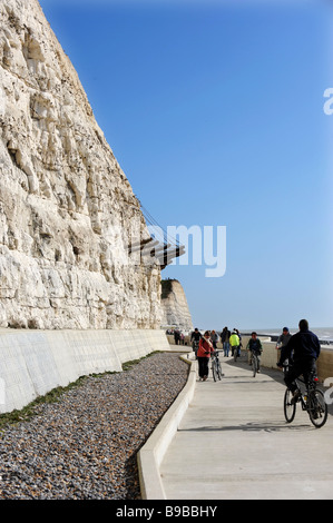 People walking and cycling along the undercliff path that runs from Brighton to Saltdean Stock Photo