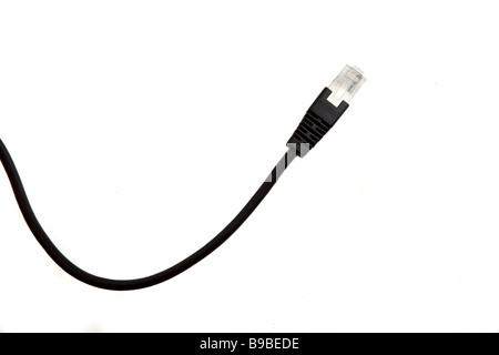 A LAN cable is seen isolated against a white background Stock Photo