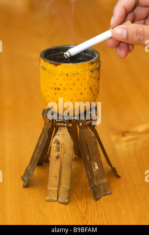 A BLU 3 cluster bomb pine apple bomb converted to an ash tray left over from the US and Vietnamese secret war in Phonsavan Laos Stock Photo