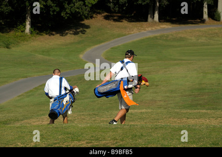 teen golfers walking on  the golf course in Columbia Maryland Stock Photo