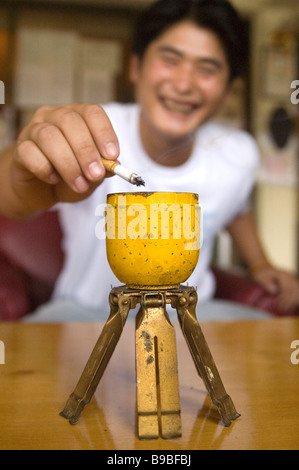 A BLU 3 cluster bomb pine apple bomb converted to an ash tray left over from the US and Vietnamese secret war in Phonsavan Laos Stock Photo