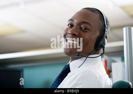 Businessman talking on headset Stock Photo